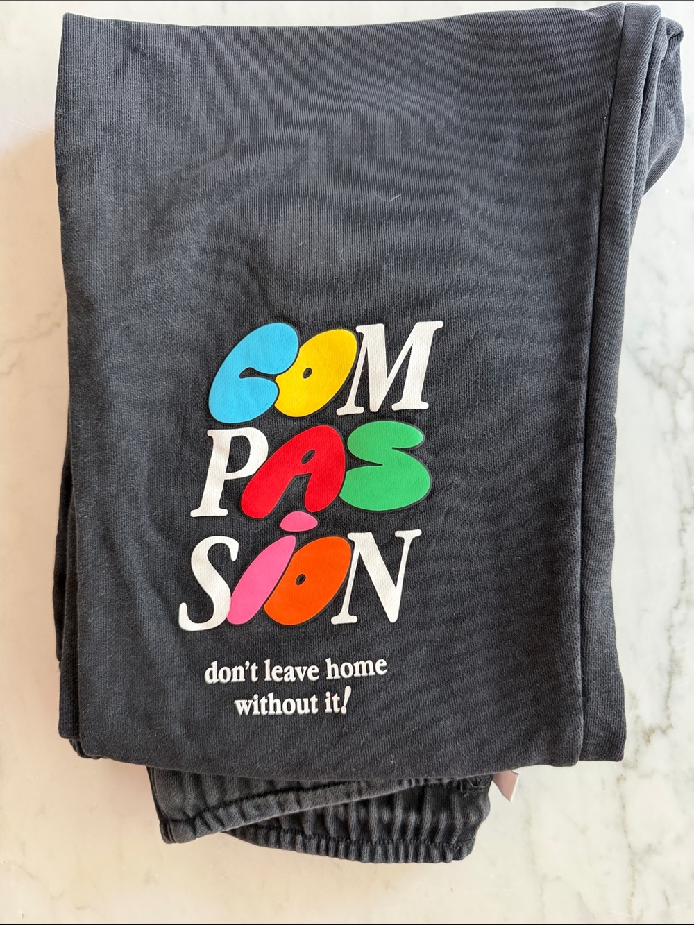 Women's Black Track Pants with Colorful 'Compassion' Graphic